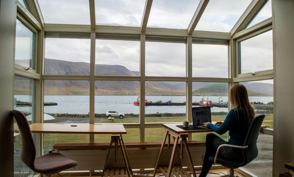 professional affiliate marketer working from home on her laptop in a beautiful setting